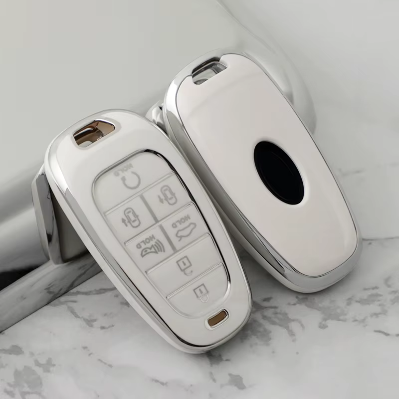 Funda de llave con botones en relieve