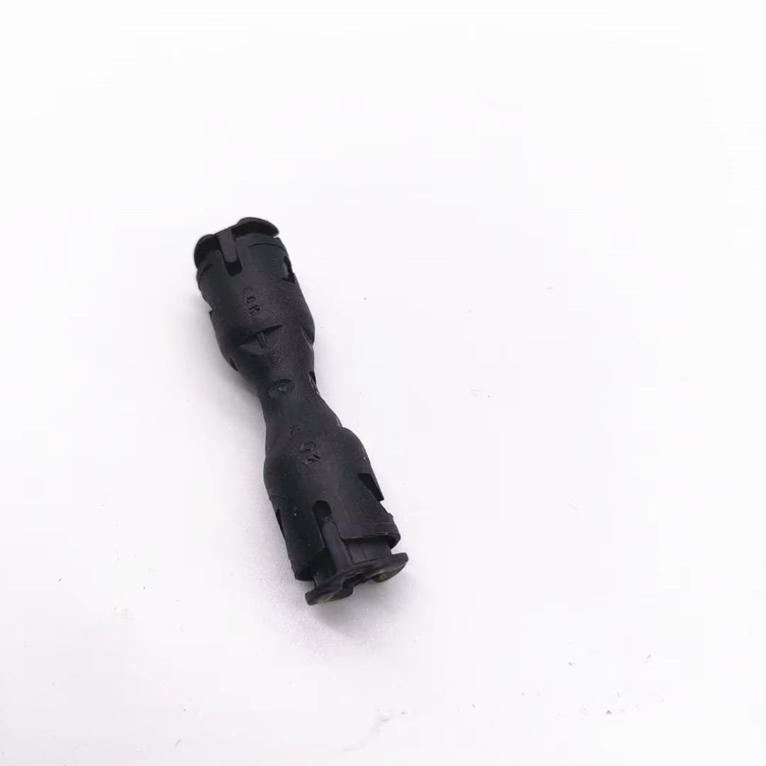 Pieza de conexión para tubo de limpieza de faros