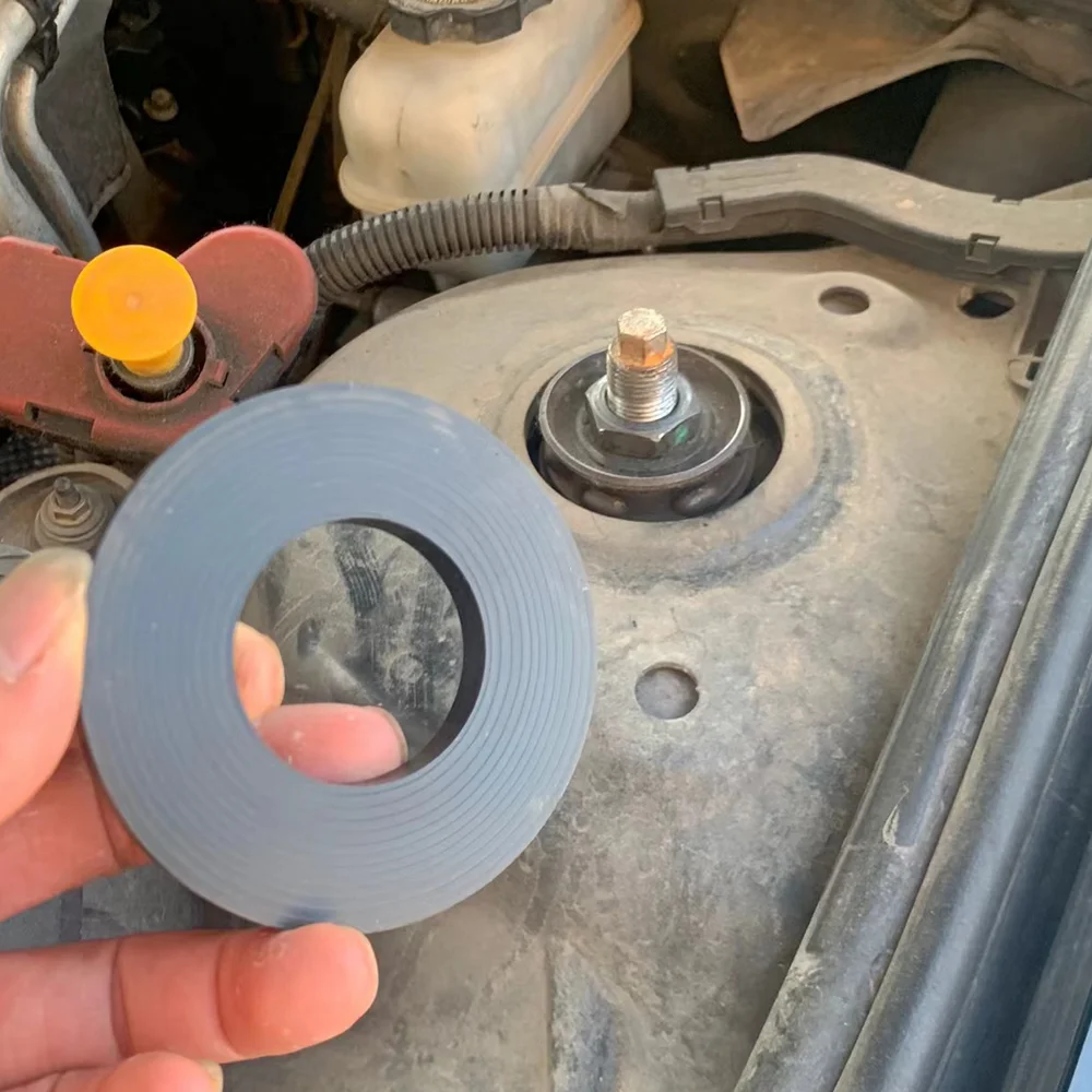 Pieza de goma para amortiguación automotriz