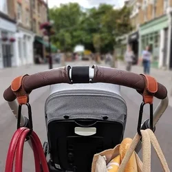 Gancho giratorio con bolsa de almacenamiento para cochecito de bebé